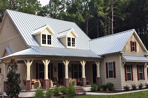 white house with metal roof|white house with galvalume roof.